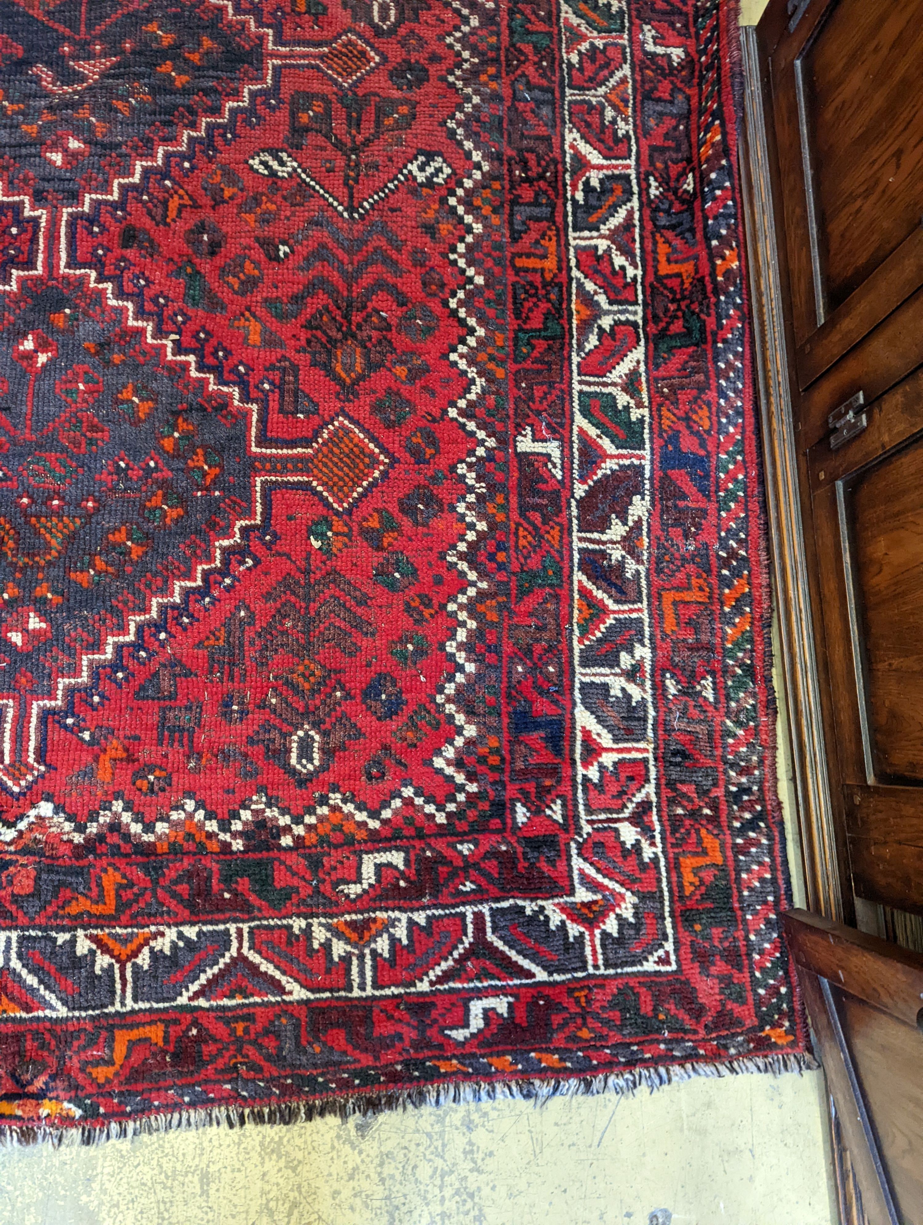 A Caucasian design red ground rug, 200 x 160cm